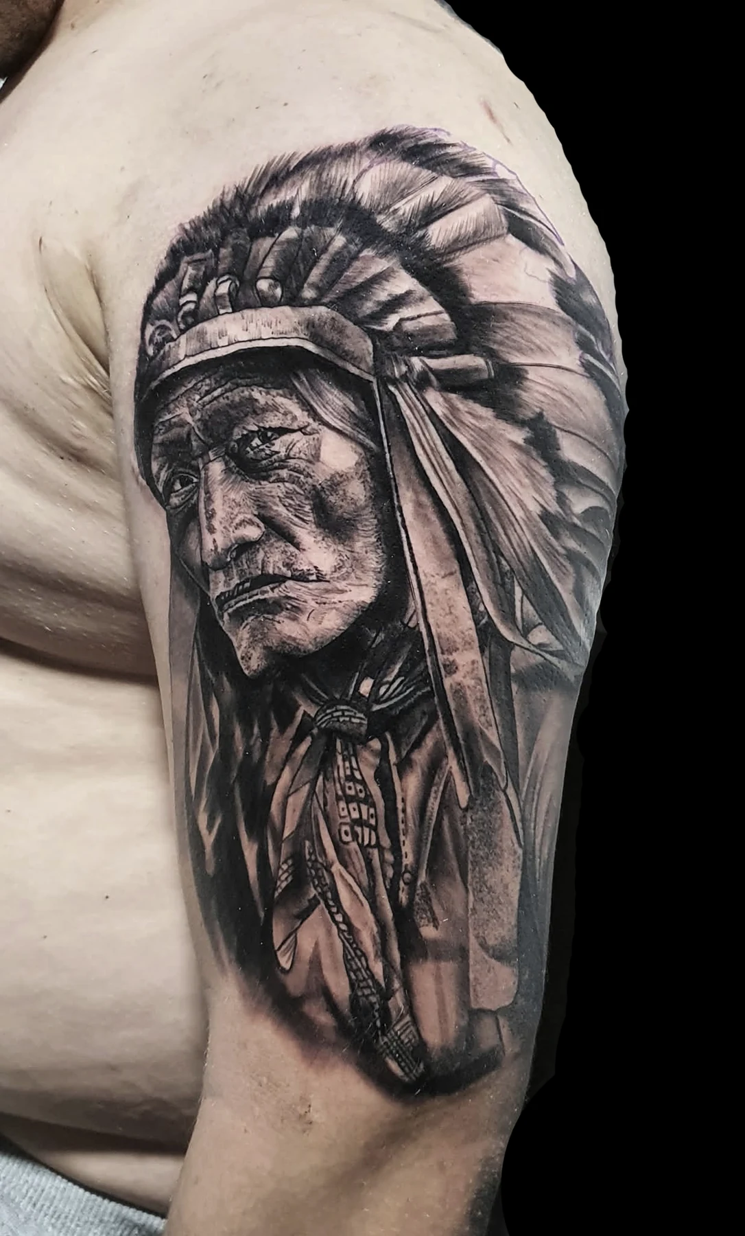 Black and grey portrait shoulder tattoo by LS
